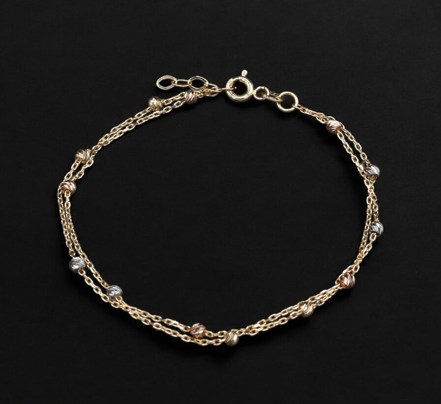 Bracciale Intrecciato in Oro 18 Carati con Sfere Eleganti