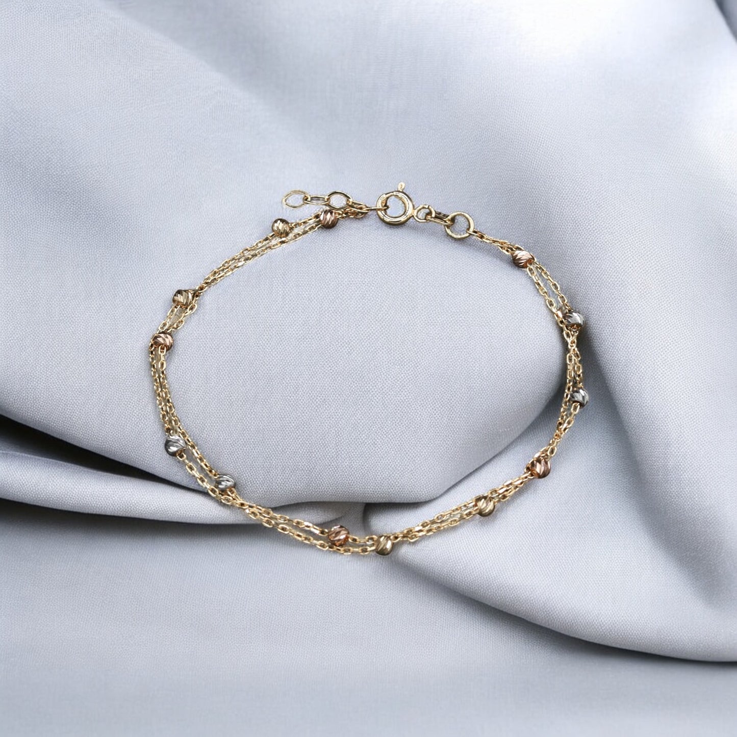 Bracciale Intrecciato in Oro 18 Carati con Sfere Eleganti
